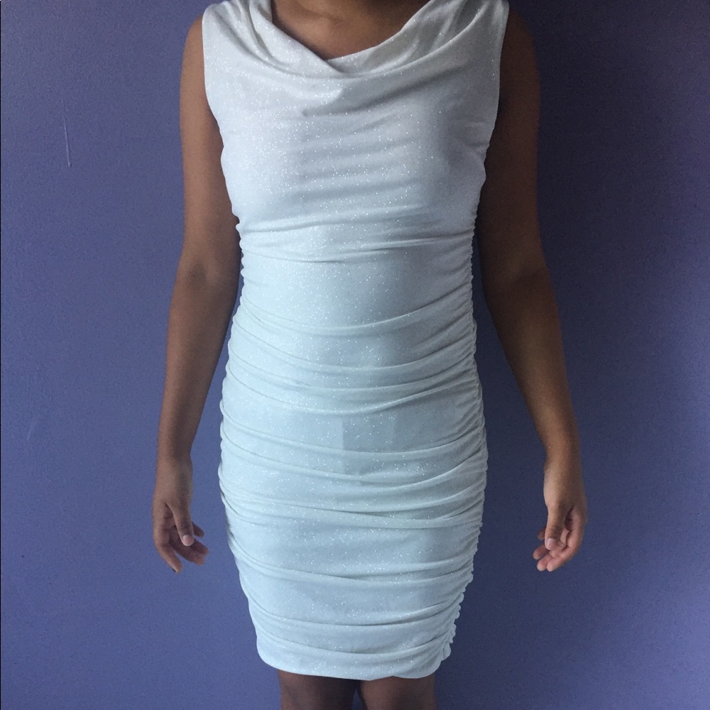 a white wrinkly sparkly dress